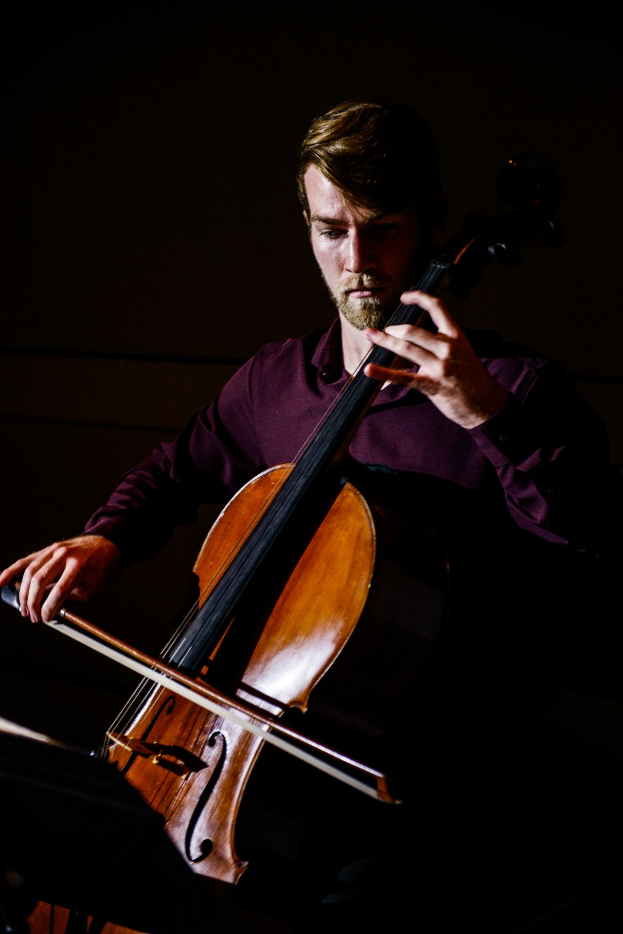 UT Dallas student Nate Mills performing on the cello.